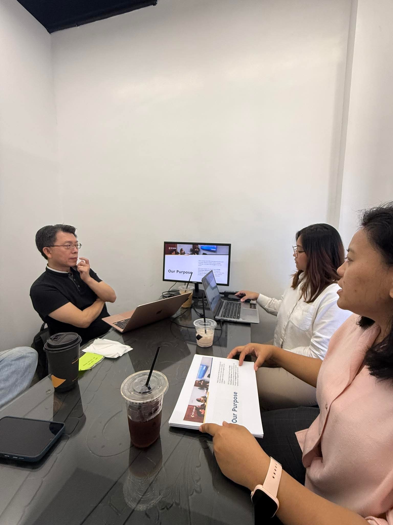 KSF consultant meeting with a client reviewing the Our Purpose company profile